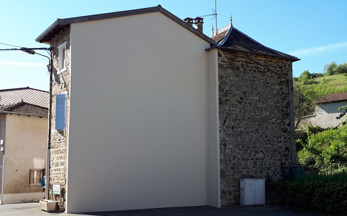 Rénovation thermique du pignon d'une maison de village en pierres